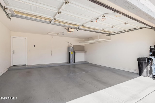 garage featuring a garage door opener and electric water heater