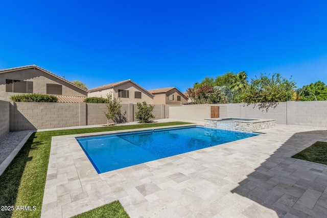 view of pool featuring a fenced backyard, a patio, and a pool with connected hot tub