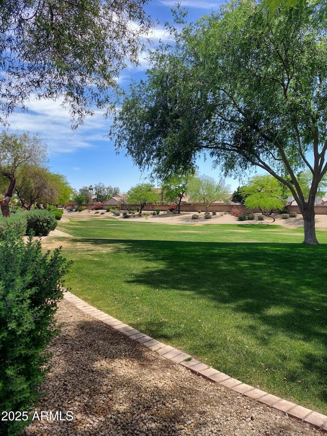 surrounding community with a yard