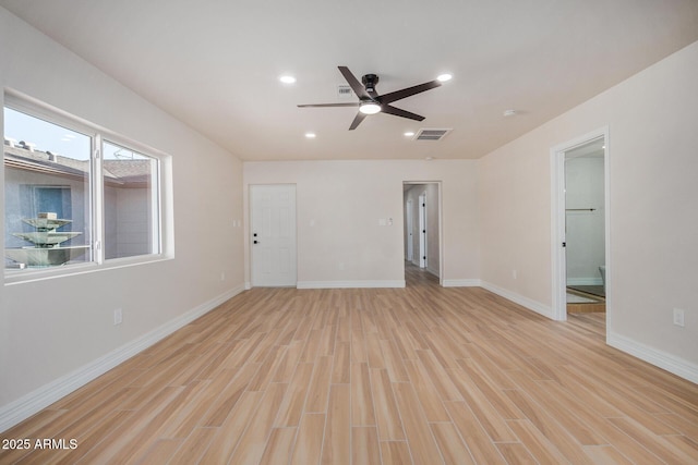 empty room with light wood-type flooring and ceiling fan