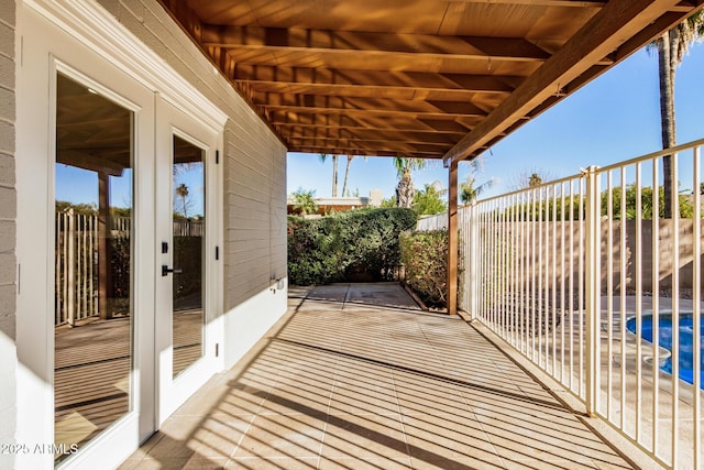 view of patio featuring french doors and a fenced in pool