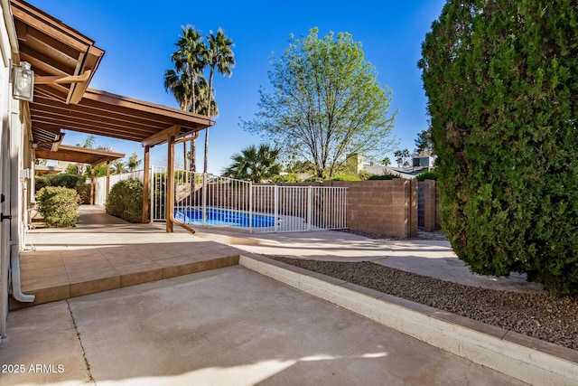 view of swimming pool with a patio