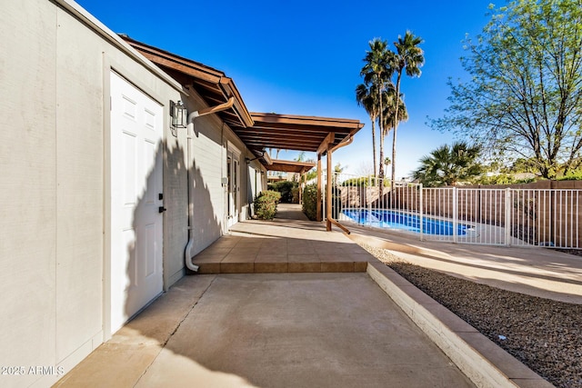 view of patio / terrace with a fenced in pool