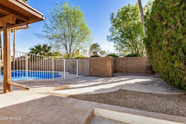 exterior space featuring a patio area and a fenced in pool