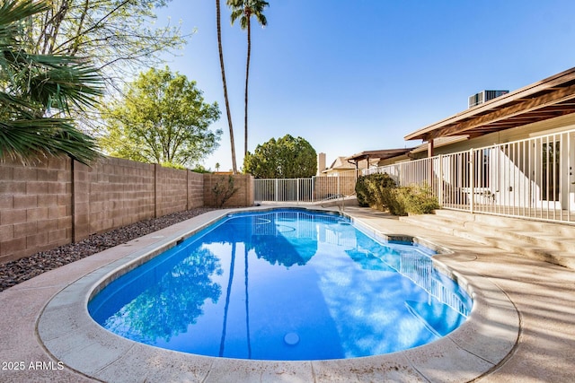 view of swimming pool featuring central AC and a patio area