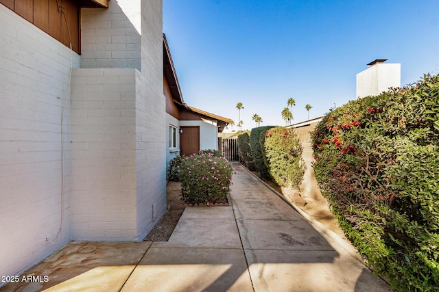 view of side of property featuring a patio