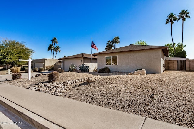 ranch-style home featuring a garage