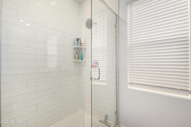 bathroom featuring a stall shower