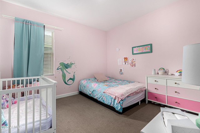 carpeted bedroom with baseboards