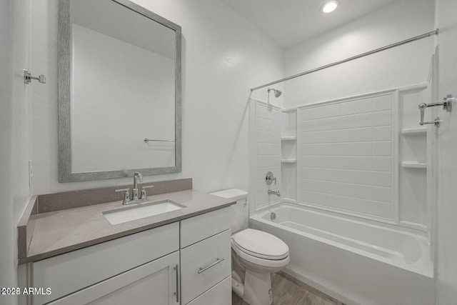 full bathroom featuring hardwood / wood-style flooring, vanity, toilet, and  shower combination