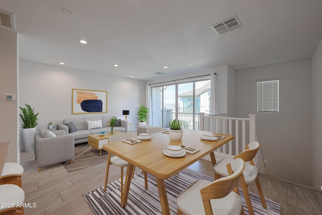 dining area featuring light wood-type flooring