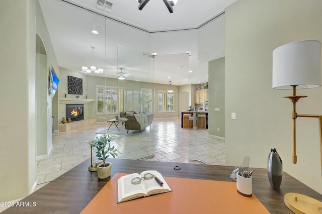 3531 E Norwood Cir, Mesa, AZ 85213 - office with a ceiling fan, a glass covered fireplace, arched walkways, baseboards, and recessed lighting