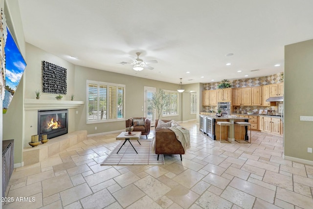 3531 E Norwood Cir, Mesa, AZ 85213 - living area with baseboards, a fireplace, ceiling fan, stone tile flooring, and recessed lighting