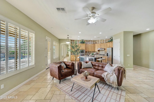 3531 E Norwood Cir, Mesa, AZ 85213 - living room with stone tile flooring, a ceiling fan, baseboards, and recessed lighting