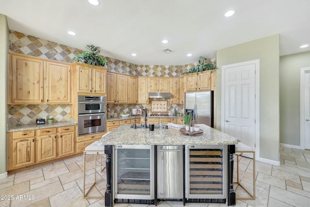 3531 E Norwood Cir, Mesa, AZ 85213 - kitchen with wine cooler, under cabinet range hood, stainless steel appliances, stone tile flooring, and recessed lighting