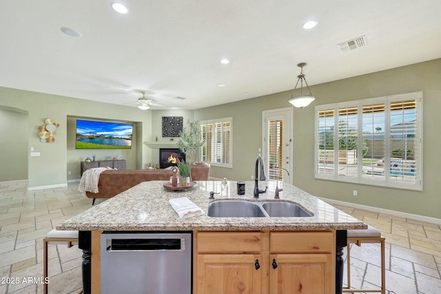 3531 E Norwood Cir, Mesa, AZ 85213 - kitchen with stainless steel dishwasher, a sink, stone tile floors, recessed lighting, and open floor plan