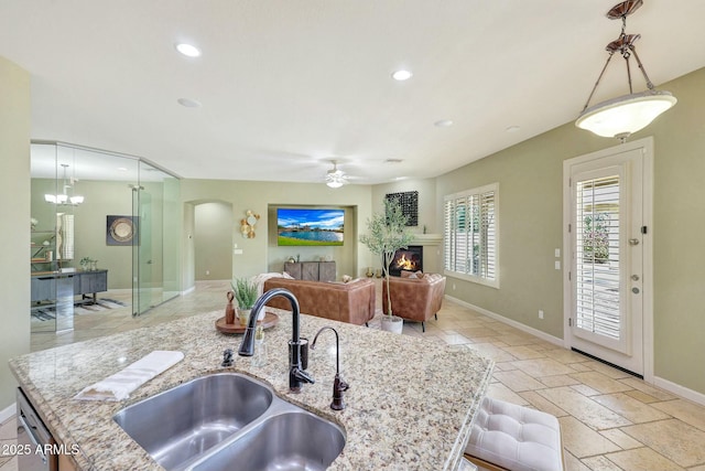 3531 E Norwood Cir, Mesa, AZ 85213 - kitchen featuring a sink, arched walkways, ceiling fan, baseboards, and recessed lighting