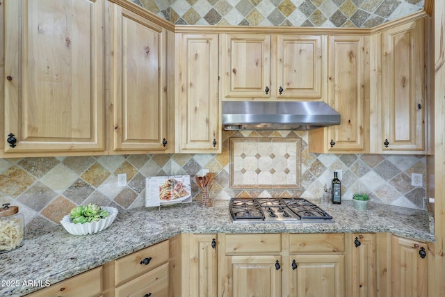 3531 E Norwood Cir, Mesa, AZ 85213 - kitchen featuring under cabinet range hood, stainless steel gas cooktop, backsplash, light stone countertops, and light brown cabinetry