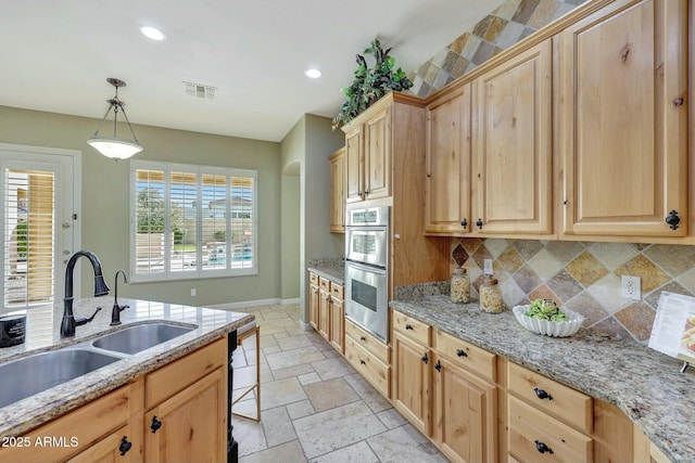 3531 E Norwood Cir, Mesa, AZ 85213 - kitchen featuring a sink, light brown cabinets, stone tile flooring, backsplash, and recessed lighting