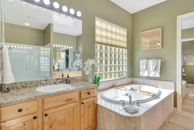3531 E Norwood Cir, Mesa, AZ 85213 - bathroom featuring vanity, a bath, walk in shower, and tile patterned floors