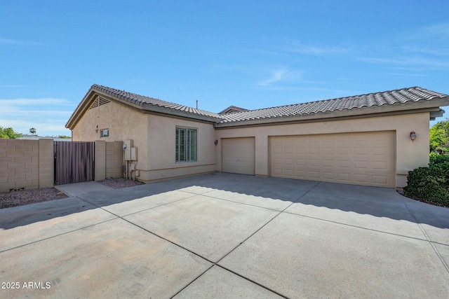 3531 E Norwood Cir, Mesa, AZ 85213 - view of front of property featuring driveway, a gate, a garage, and stucco siding