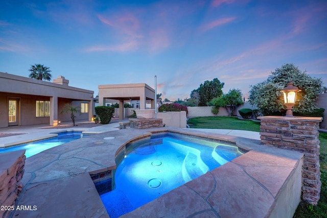 3531 E Norwood Cir, Mesa, AZ 85213 - pool at dusk featuring a patio area and an in-ground hot tub