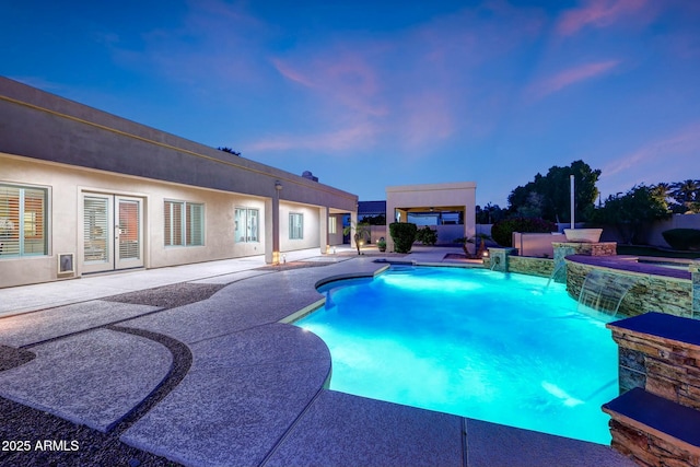 3531 E Norwood Cir, Mesa, AZ 85213 - pool at dusk featuring a patio area and a pool with connected hot tub
