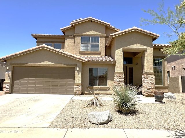 33506 N 24th Dr, Phoenix, AZ 85085 - view of front of house with a tiled roof, stone siding, stucco siding, concrete driveway, and a garage