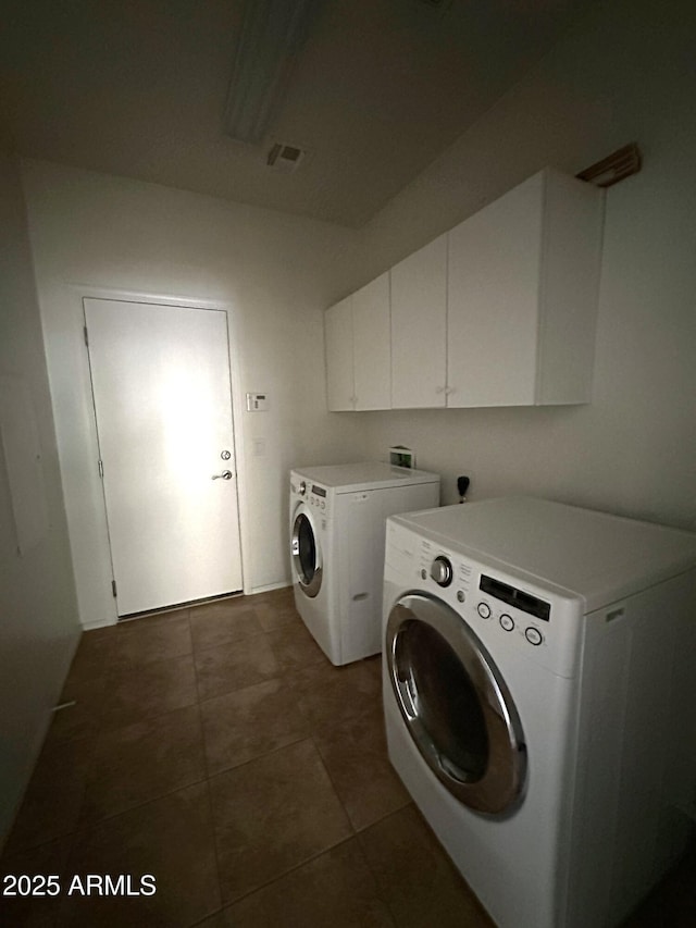 33506 N 24th Dr, Phoenix, AZ 85085 - laundry room featuring washer and clothes dryer, cabinet space, and dark tile patterned floors