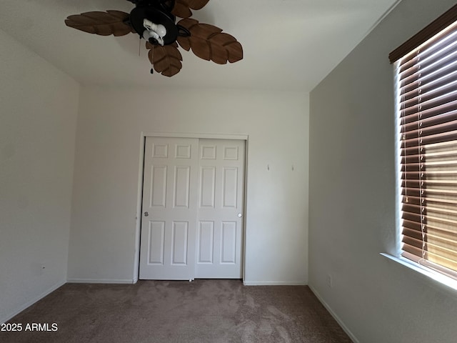 33506 N 24th Dr, Phoenix, AZ 85085 - unfurnished bedroom featuring carpet floors, baseboards, ceiling fan, and a closet