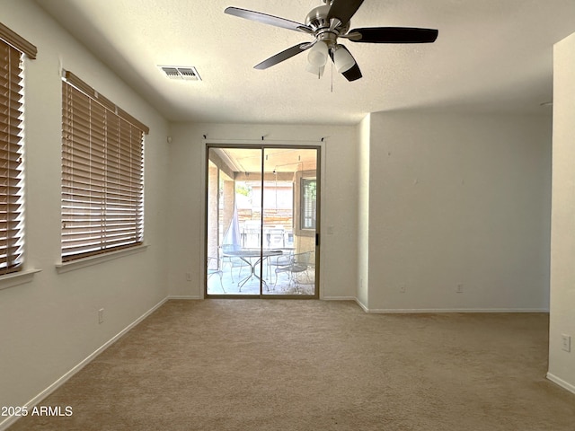 33506 N 24th Dr, Phoenix, AZ 85085 - unfurnished room with carpet floors, ceiling fan, baseboards, and a textured ceiling