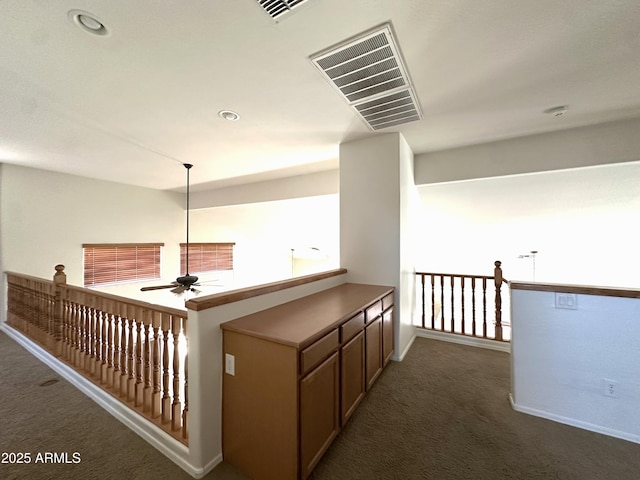 33506 N 24th Dr, Phoenix, AZ 85085 - hallway with dark colored carpet and baseboards
