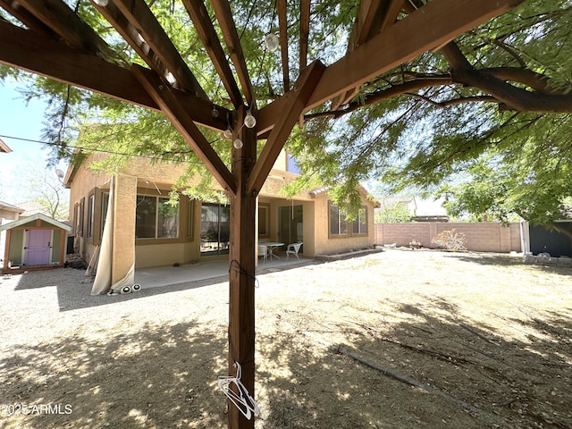 33506 N 24th Dr, Phoenix, AZ 85085 - back of house with a patio and stucco siding