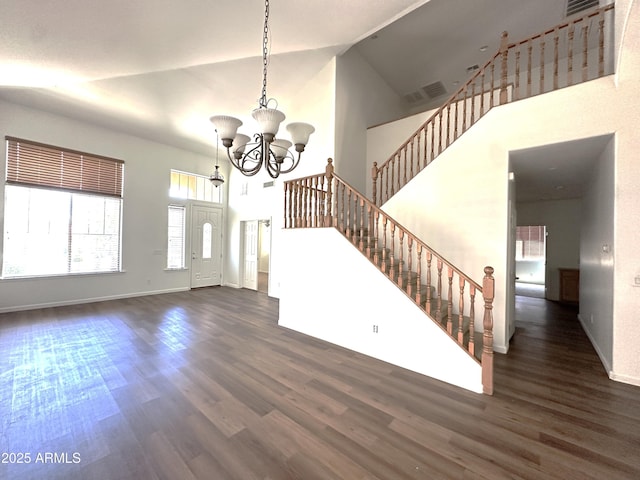 33506 N 24th Dr, Phoenix, AZ 85085 - unfurnished living room with high vaulted ceiling, wood finished floors, a chandelier, stairs, and baseboards