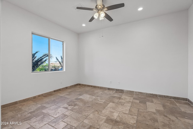 spare room with ceiling fan