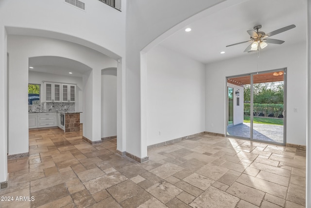 unfurnished room featuring ceiling fan