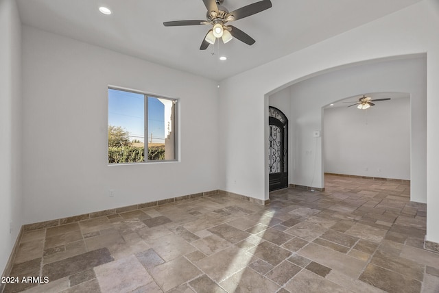 empty room featuring ceiling fan