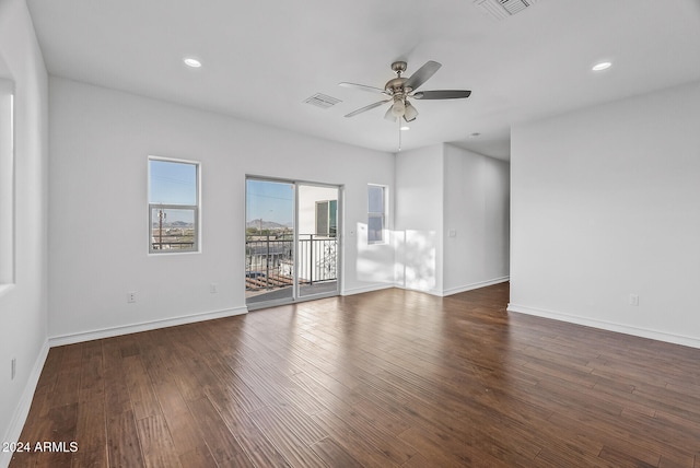 unfurnished room featuring ceiling fan and dark hardwood / wood-style floors