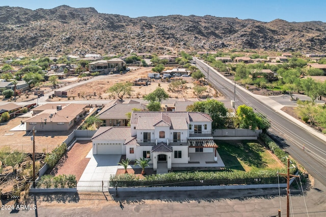 birds eye view of property featuring a mountain view