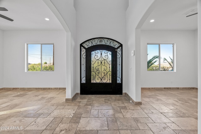 entryway featuring ceiling fan and plenty of natural light