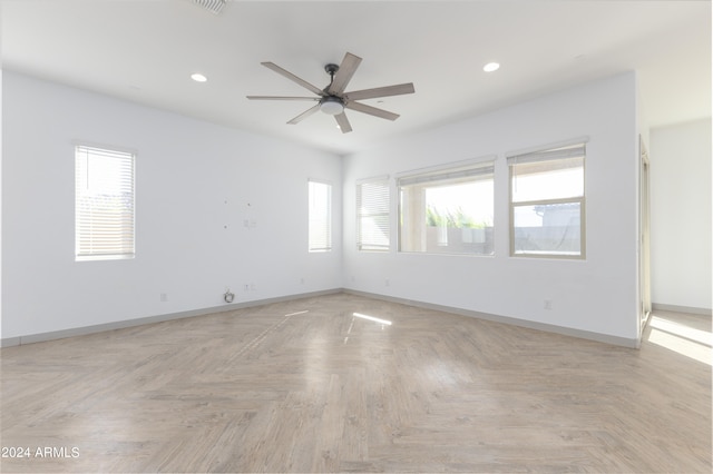 spare room featuring ceiling fan and light parquet flooring