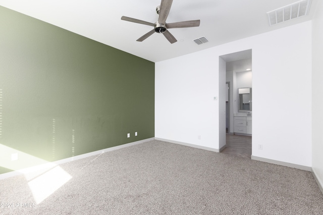 empty room with carpet floors and ceiling fan