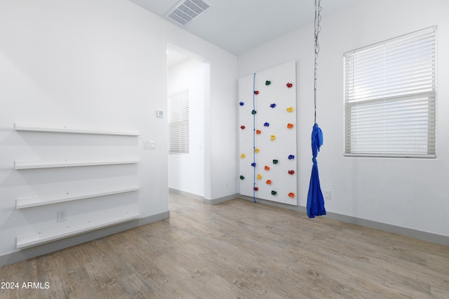 unfurnished room featuring light hardwood / wood-style floors