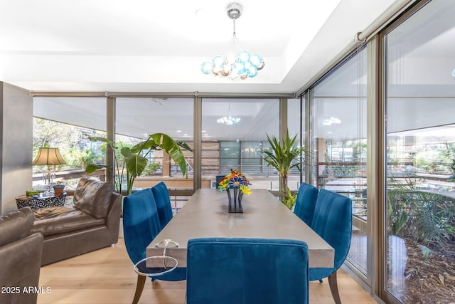 sunroom with a notable chandelier