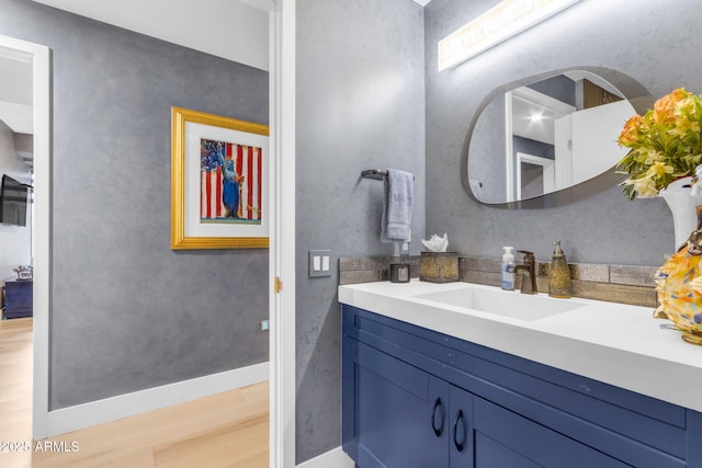 bathroom featuring vanity and wood-type flooring