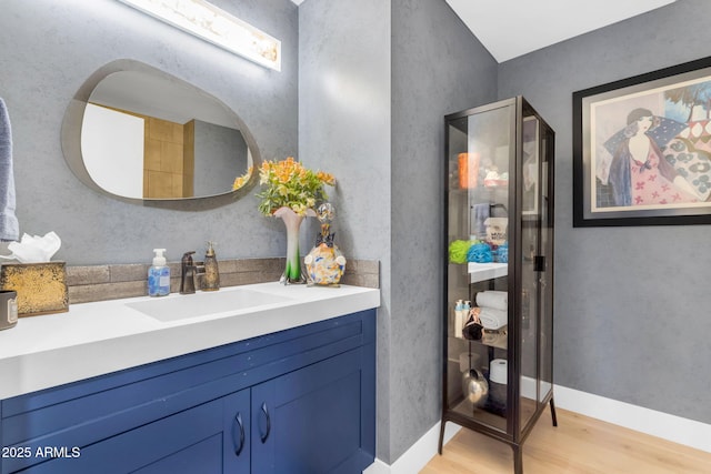 bathroom featuring vanity and hardwood / wood-style flooring