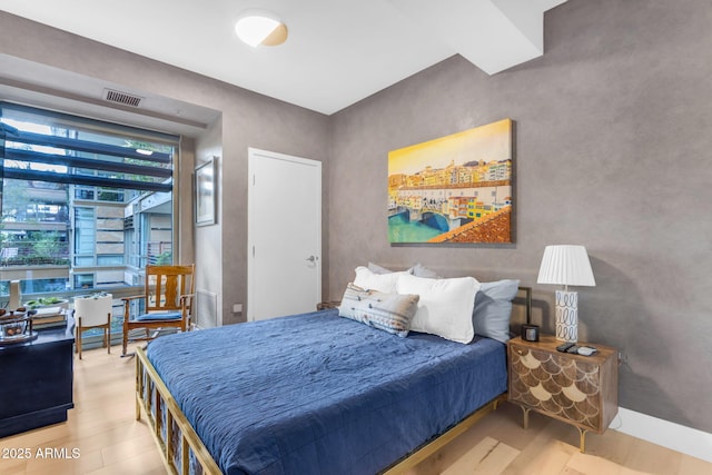 bedroom featuring hardwood / wood-style flooring