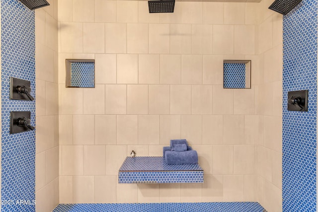 bathroom with a tile shower