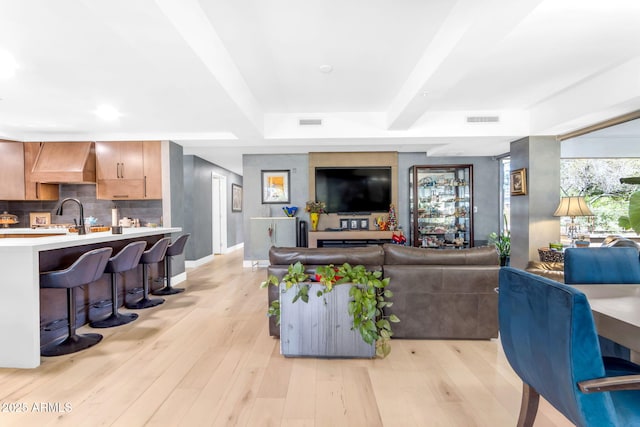 living room with light hardwood / wood-style flooring