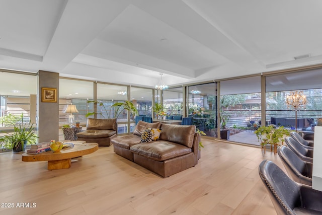 sunroom featuring a notable chandelier